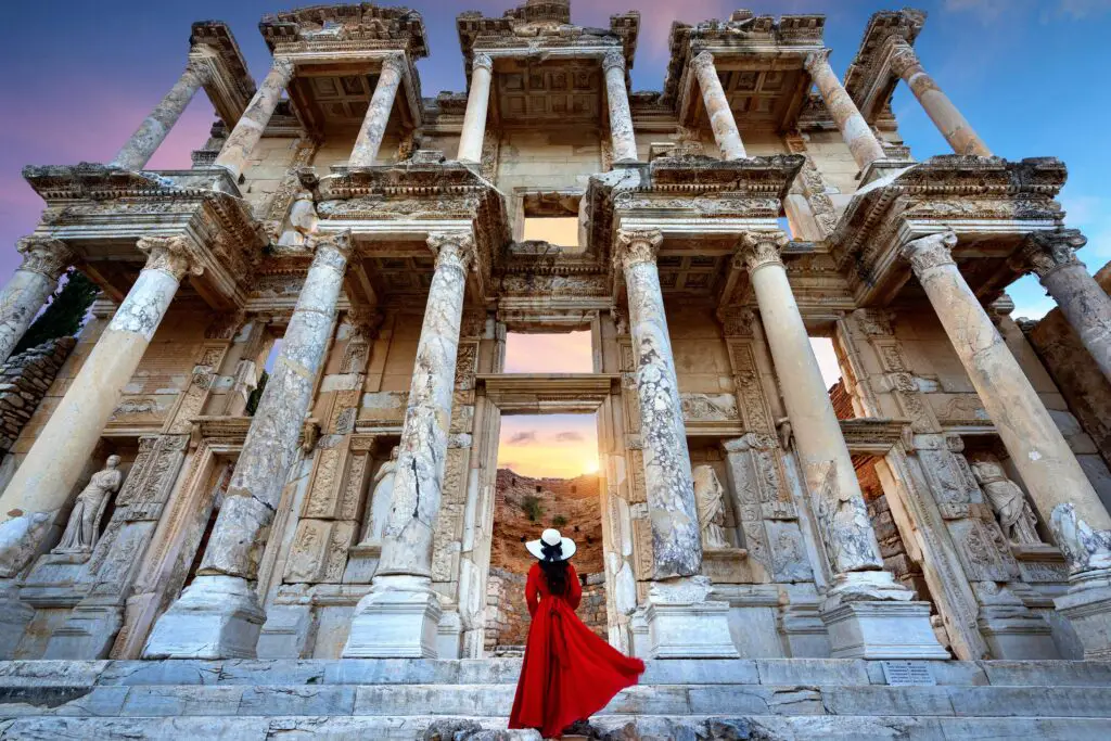 woman standing celsus library ephesus ancient city izmir turkey min